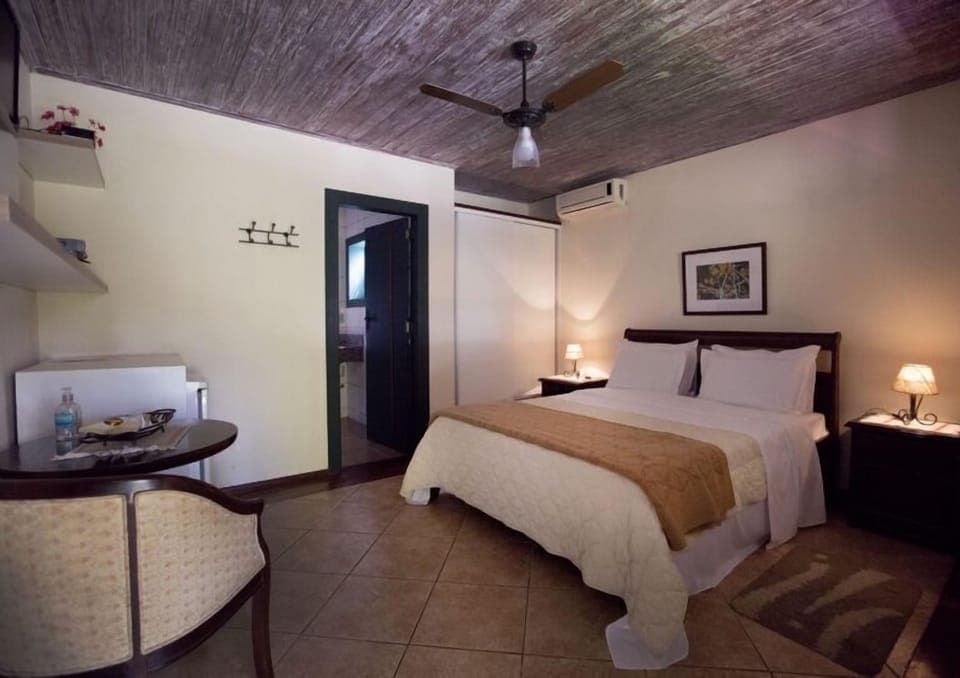 Standard Double Room | Minibar, desk, blackout drapes, iron/ironing board