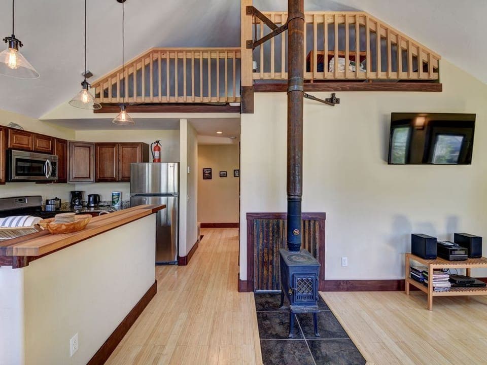 Looking up at loft from living room