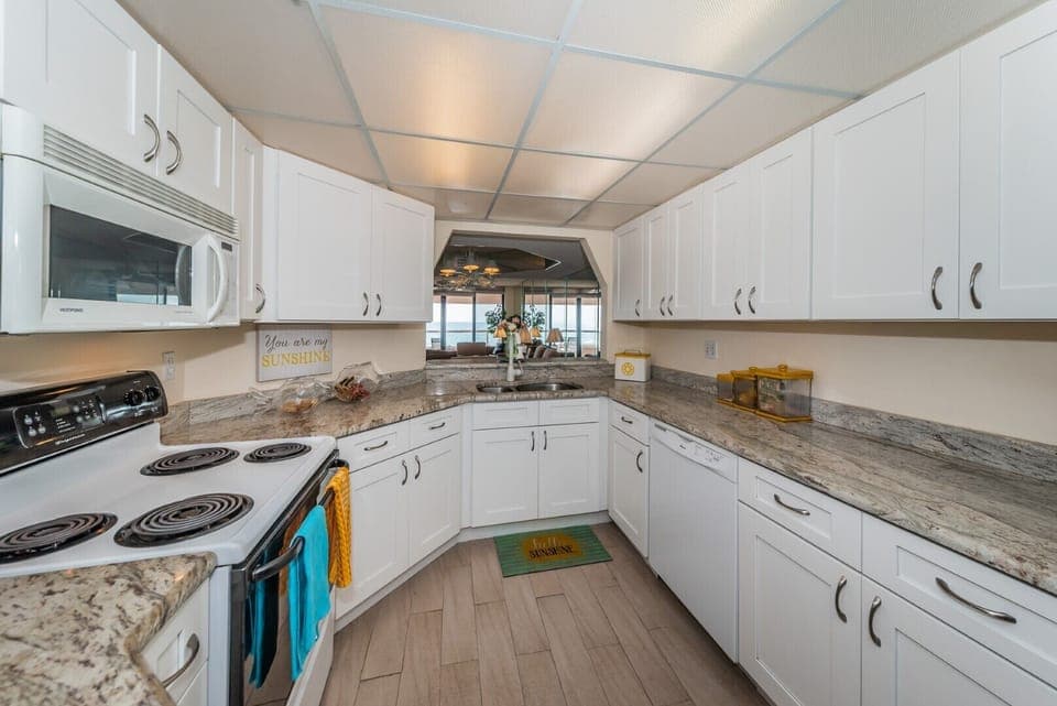 New kitchen also looks out  to the Gulf.  Prepare meals watching boats sail by.