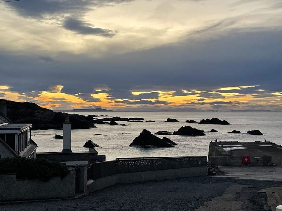 Sunset view out beyond harbour