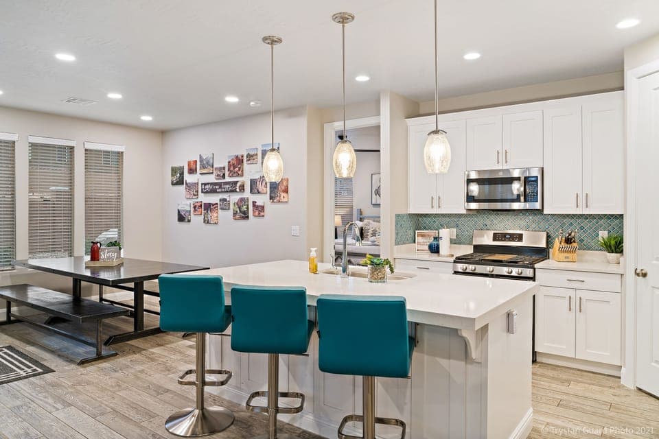 Fully stocked gourmet kitchen featuring extra seating at the bar