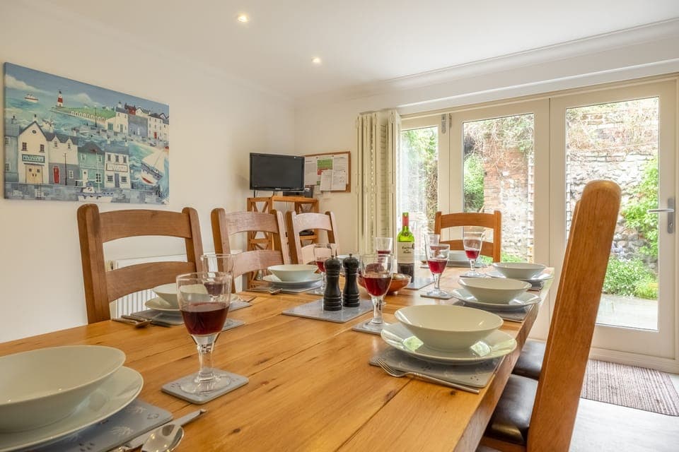 Ground floor: Dining area with seating for eight people