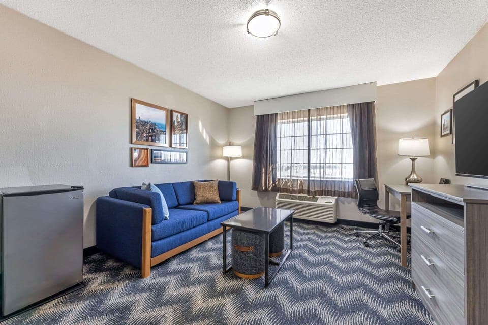 Family Suite, 1 King Bed with Sofa bed, Non Smoking | Living area | 40-inch flat-screen TV with cable channels, TV, books