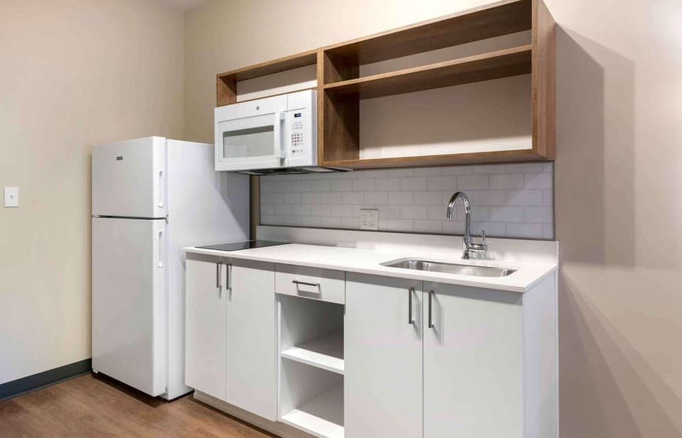 Fridge, microwave, stovetop, cookware/dishes/utensils
