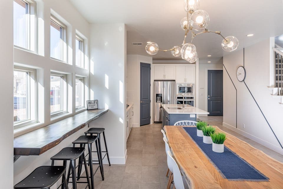 Dining Table - Share memories and stories while enjoying a family style meal around the Dining Table with extra seating at the bar top and kitchen island.