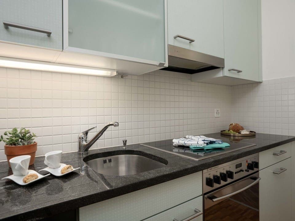 Kitchen, Countertop, Kitchen Appliance, Interior Design, Kitchen Sink, Cabinetry, Wood, Major Appliance, Flooring, Plumbing Fixture