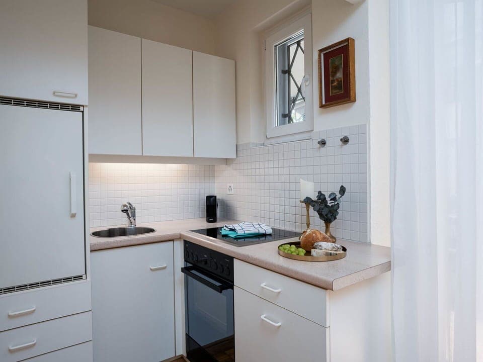 Kitchen, Countertop, Kitchen Appliance, Cabinetry, Furniture, Major Appliance, Interior Design, Wood, Flooring, Home Appliance