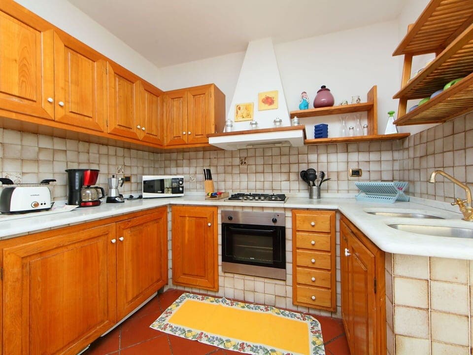 Countertop, Kitchen, Cabinetry, Property, Room, Furniture, Building, Orange, Interior Design, Real Estate