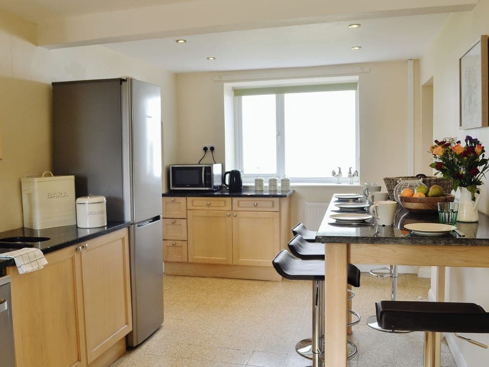 Well equipped kitchen with breakfast bar area | Bryn Boda, Nantglyn, near Denbigh