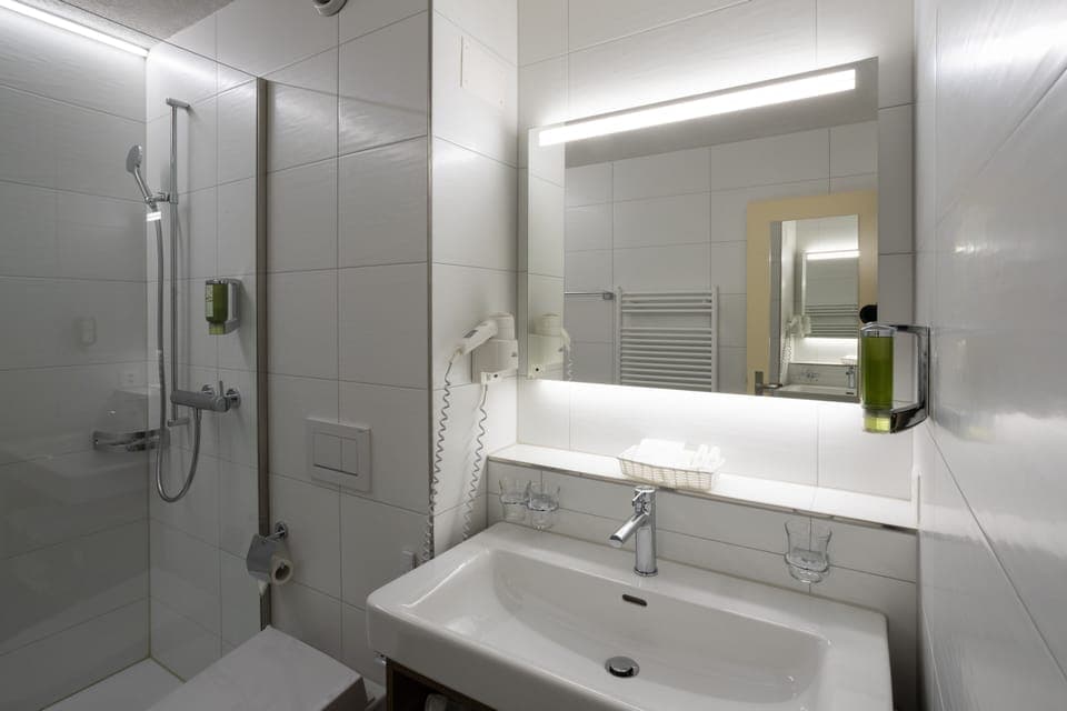 Shower, free toiletries, hair dryer, slippers
