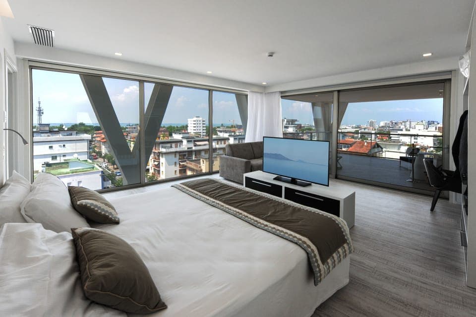 Deluxe Suite, Terrace, Partial Sea View | Minibar, in-room safe, desk, soundproofing