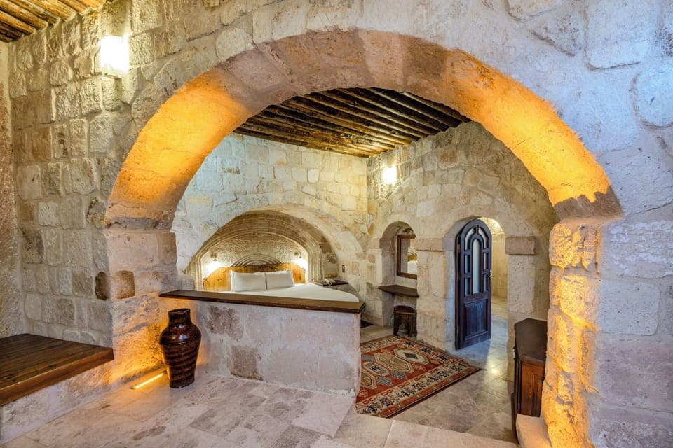 Premium King Cave Suite With Turkish Bath | Living area | 60-cm plasma TV with satellite channels, TV, fireplace