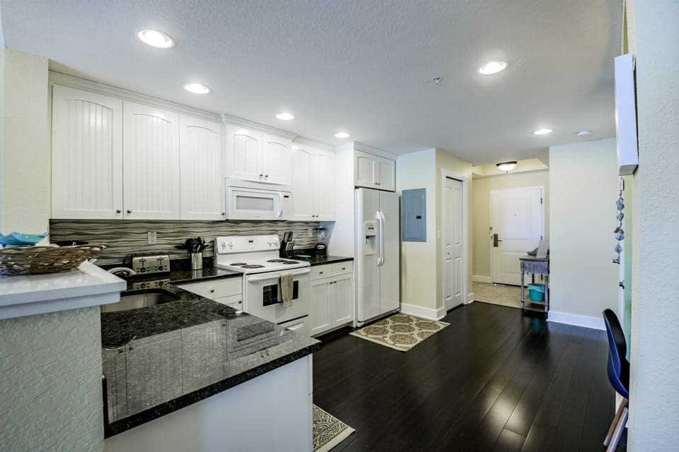 Fully equipped kitchen - fridge, range, dishwasher, microwave and stackable washer and dryer