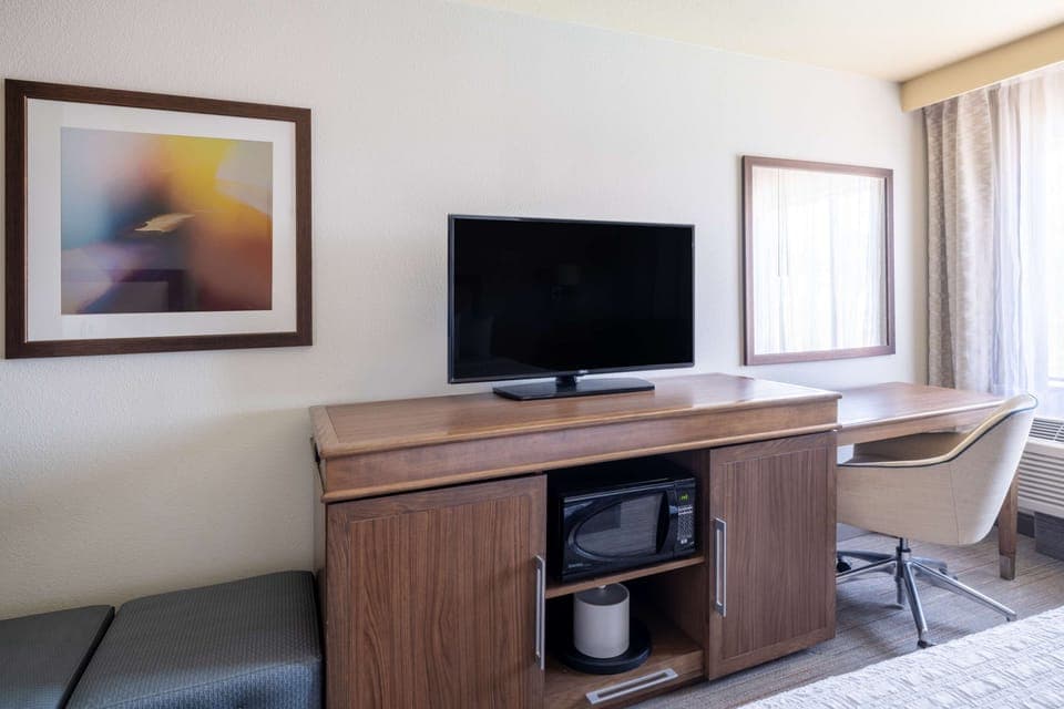 Premium bedding, desk, laptop workspace, iron/ironing board