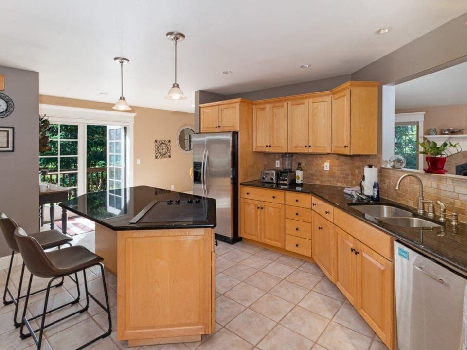 Kitchen-completely stocked w/ necessities for cooking/baking i.e. pots, pans etc