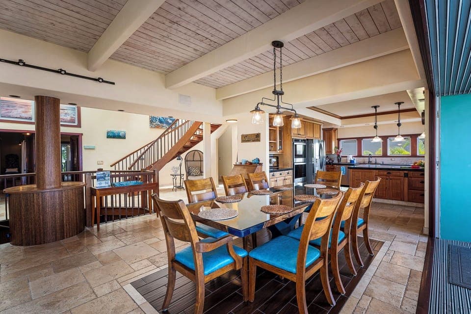 Alternate view of the great room—showcasing open-concept design and stylish tropical decor.