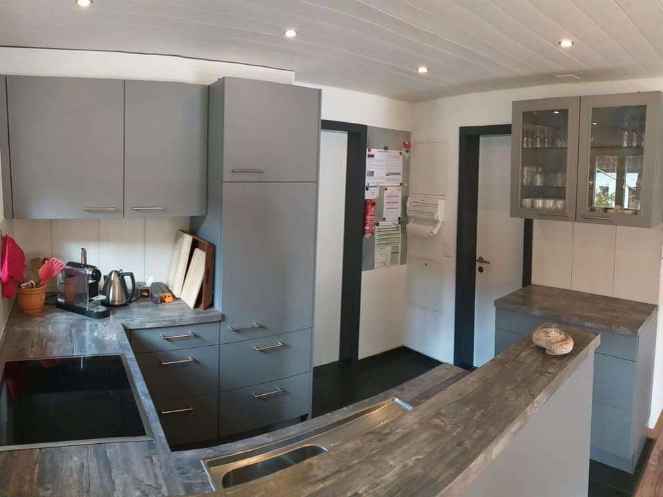 Cabinetry, Building, Countertop, Wood, Door, Lighting, Interior Design, Hall, Floor, Flooring