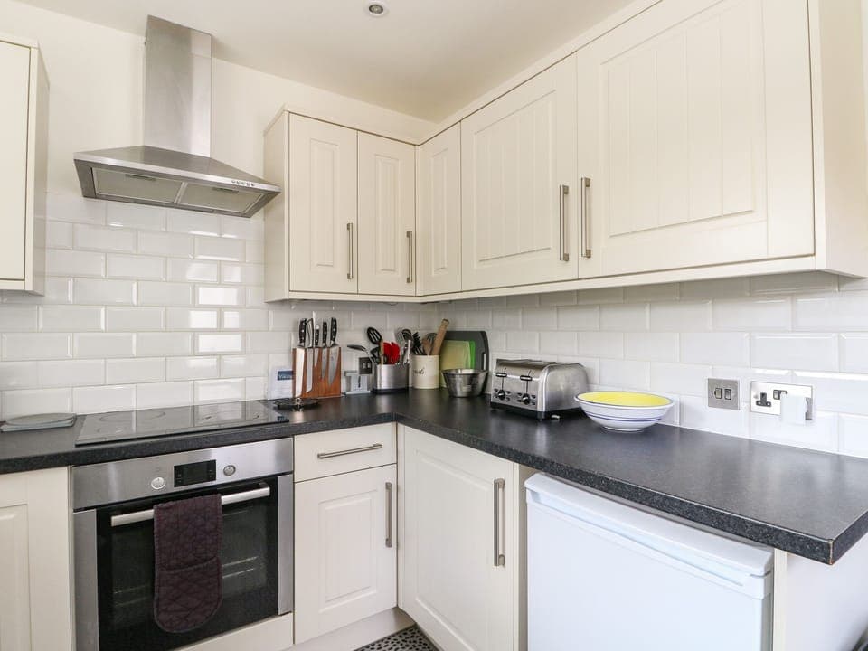 Microwave, stovetop, dishwasher, cookware/dishes/utensils