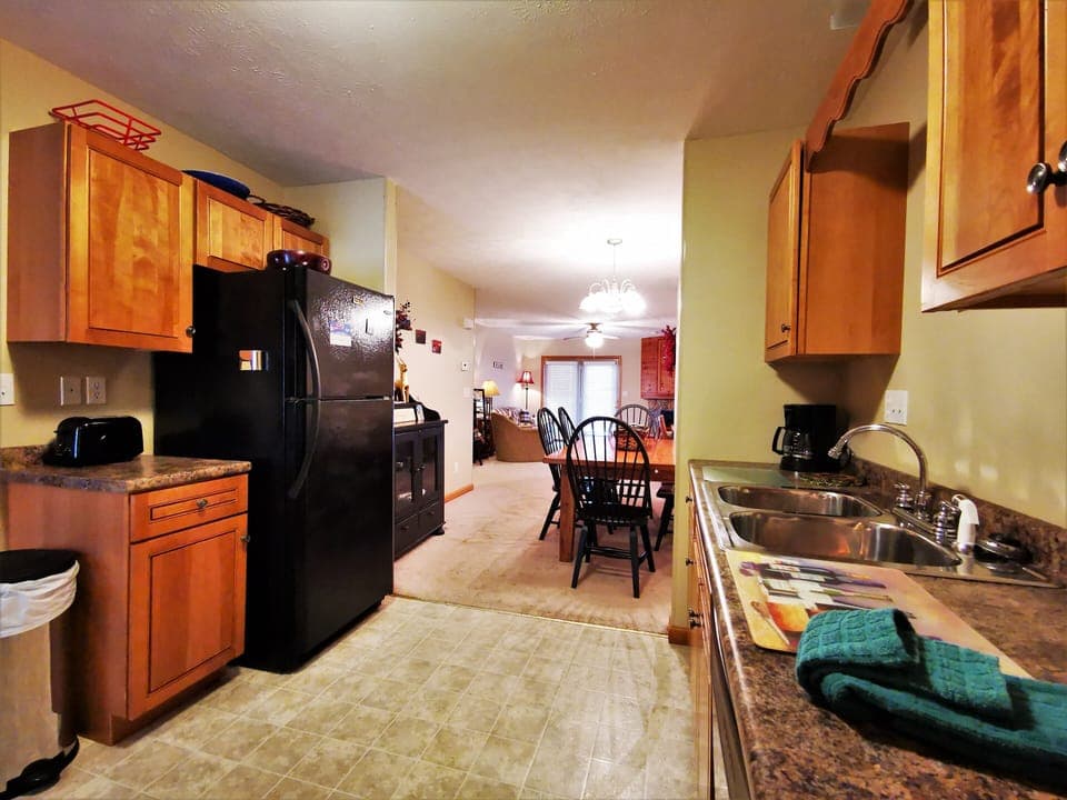 
Spacious kitchen with a view into the dining and living areas
