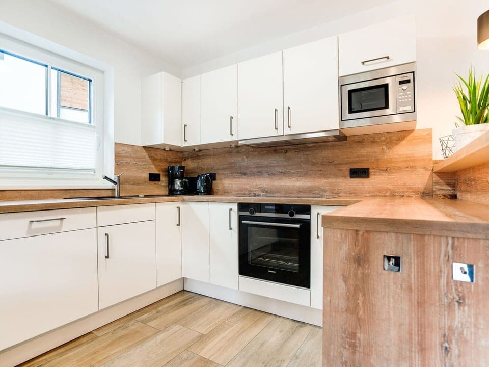 Chalet | Private kitchen | Fridge, highchair