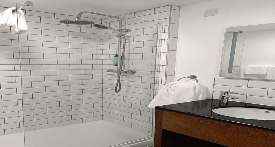 Suite, 1 King Bed, Non Smoking (Shower Only) | Select Comfort beds, desk, iron/ironing board, free WiFi