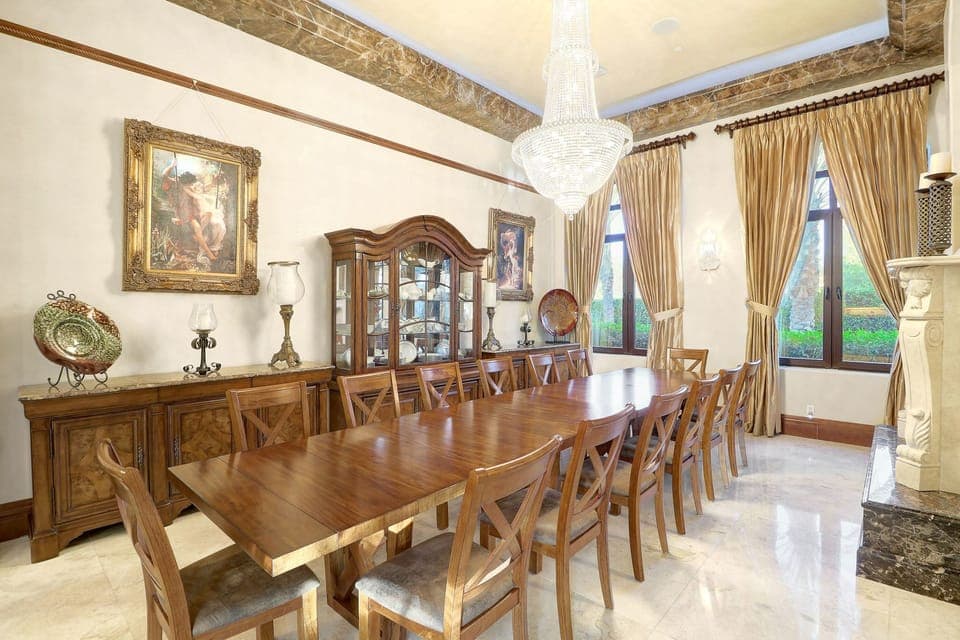 Formal dining room seating 14 people w/ fireplace off the formal seating area