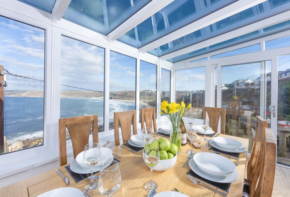 Adanac, Sennen Cove. Ground floor: Dining table with seating for eight guests