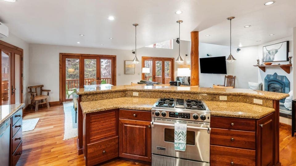 Fully stocked open concept kitchen with breakfast bar seating for 4, two ovens, gas stove, brand new appliances, drip pot coffee maker, and pantry.
