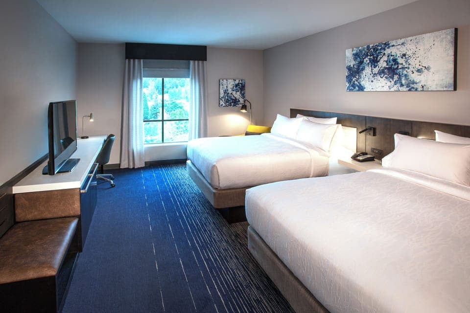 Desk, laptop workspace, blackout drapes, iron/ironing board