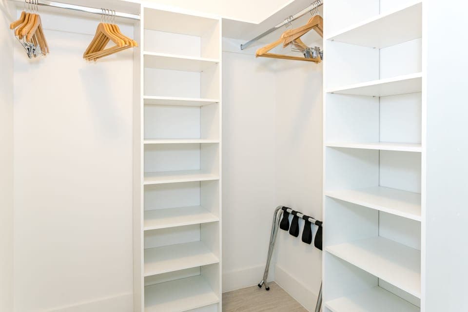 Walk-in closet with hangers.