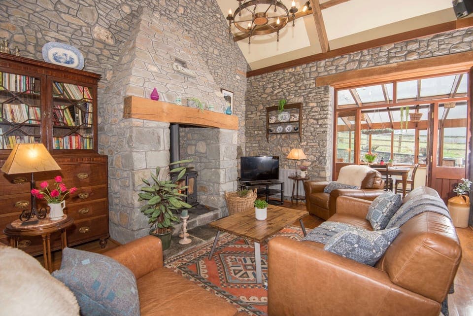 The living room is full of character with oak beams and oak floors.