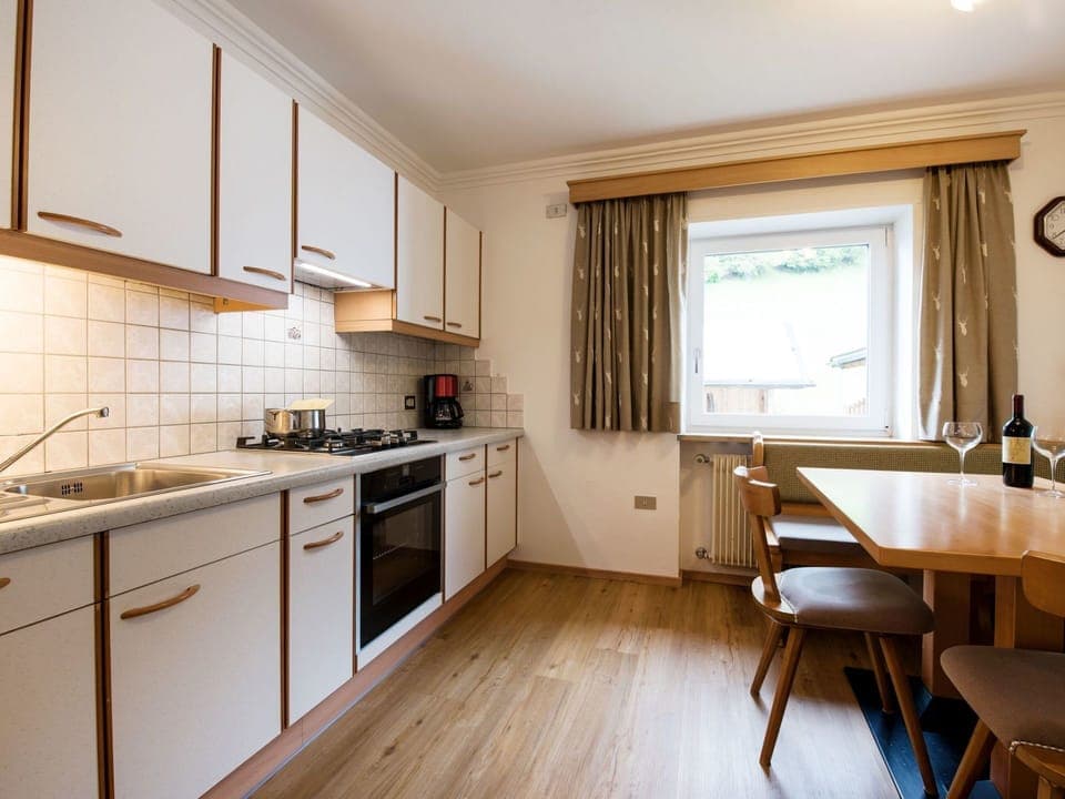 Room, Property, Furniture, Countertop, Kitchen, Cabinetry, Interior Design, Building, Floor, Yellow