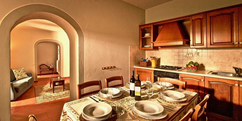 Fully equipped kitchen with 4 ring gas hob, oven, fridge freezer, table & chairs