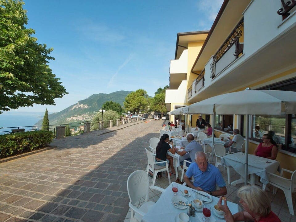 Sky, Furniture, Property, Chair, Building, Plant, Cloud, Table, Flowerpot, Shade