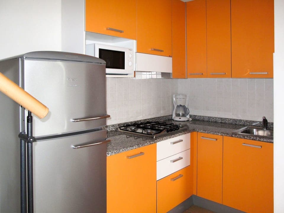 Orange, Kitchen, Cabinetry, Room, Yellow, Property, Countertop, Major Appliance, Furniture, Kitchen Appliance