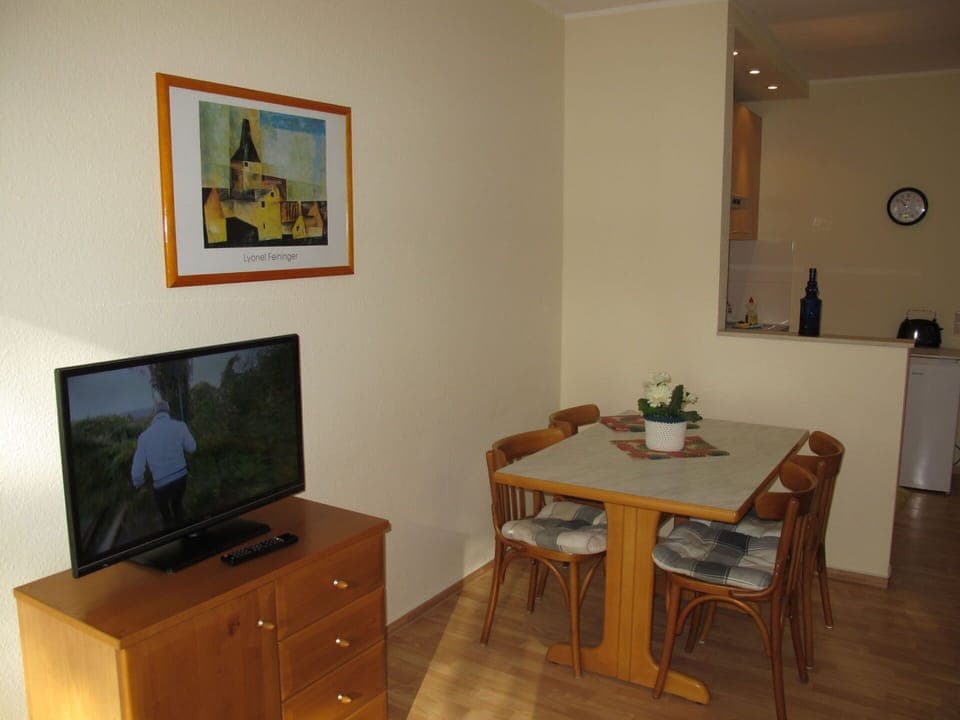 Furniture, Property, Table, Building, Interior Design, Cabinetry, Wood, Clock, Floor, Television