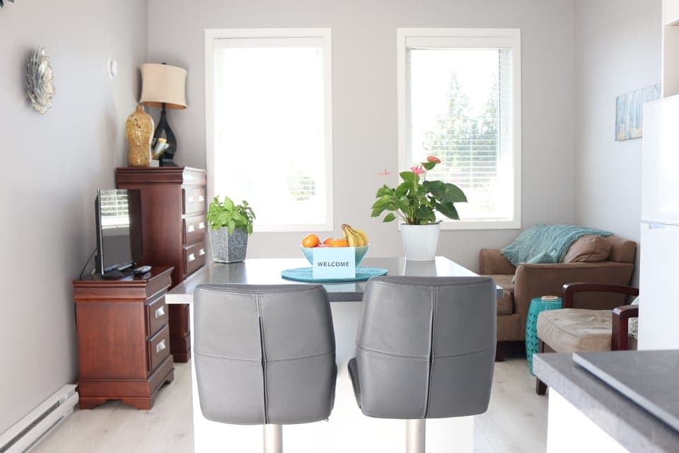 A SOUTH FACING VIEW OF THE LIVING ROOM WITH MOUNTAIN VIEWS TO YOUR LEFT!