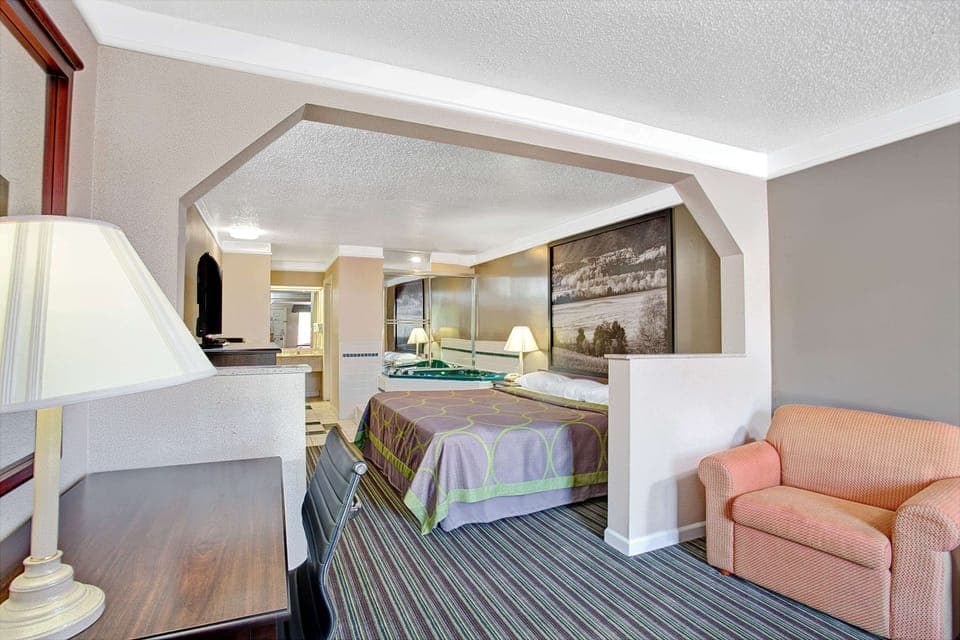 Deluxe Studio Suite, 1 King Bed, Non Smoking | Desk, blackout drapes, iron/ironing board, free cribs/infant beds
