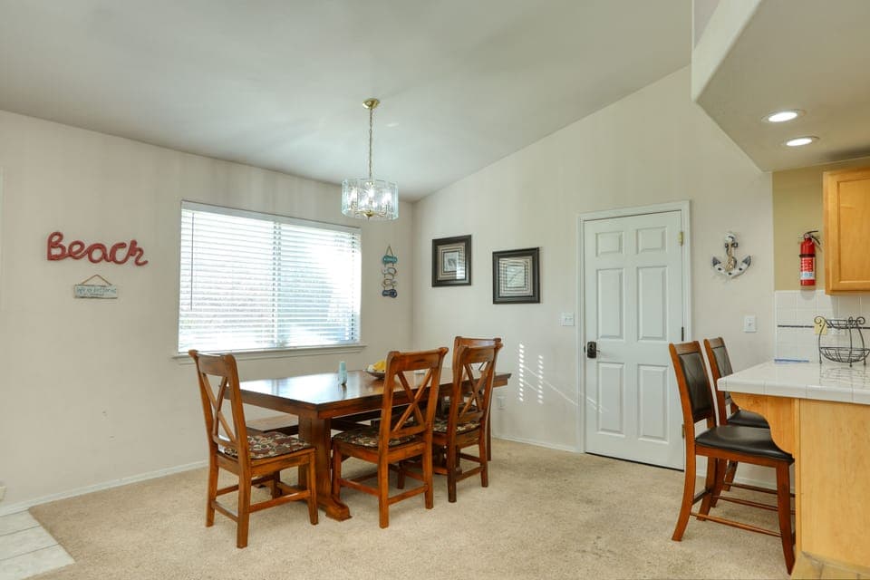 Wide view of dining table in vacation rental unit