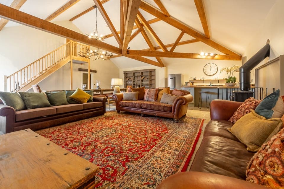 The Owl House, Little Massingham: Spacious open-plan living area with wood burning stove