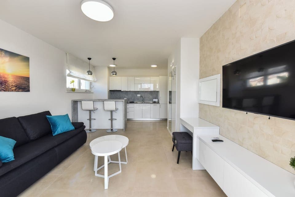 Deluxe Apartment, 3 Bedrooms, Non Smoking, Terrace | Living area | 45-inch flat-screen TV with satellite channels, TV