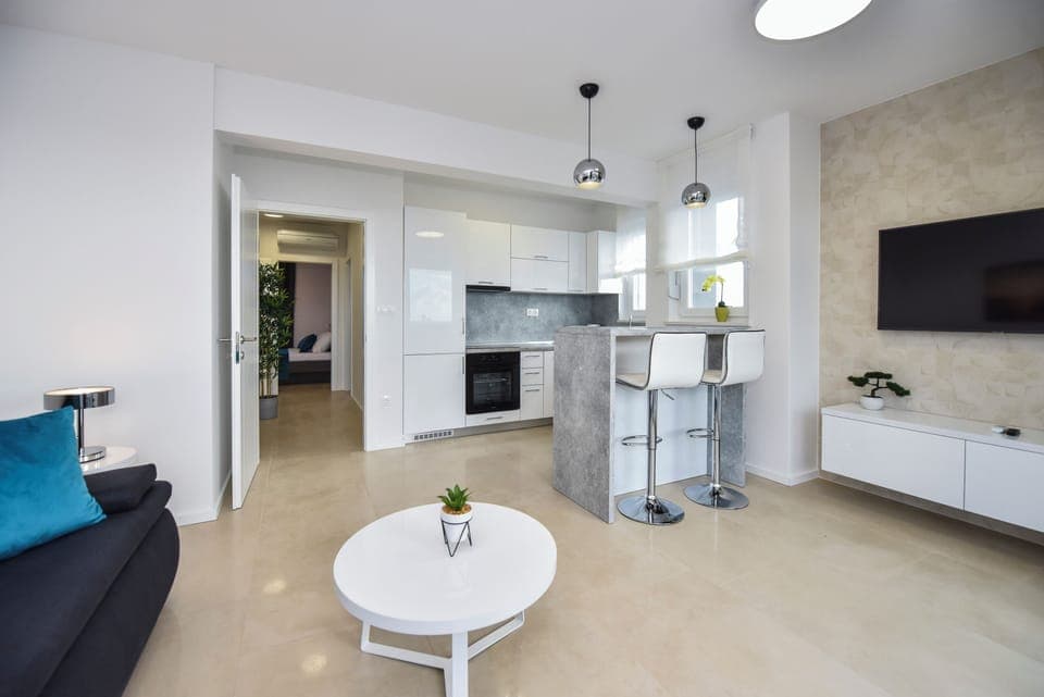 Deluxe Apartment, 3 Bedrooms, Non Smoking, Terrace | Living area | 45-inch flat-screen TV with satellite channels, TV