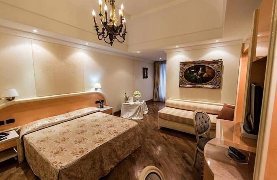 Standard Triple Room | Minibar, in-room safe, desk, laptop workspace