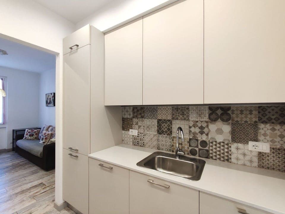 Cabinetry, Sink, Kitchen Sink, Countertop, Wood, Flooring, Interior Design, Kitchen Stove, Floor, Kitchen