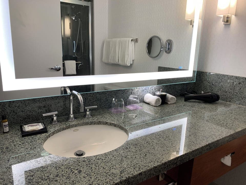 Designer toiletries, hair dryer, towels, soap