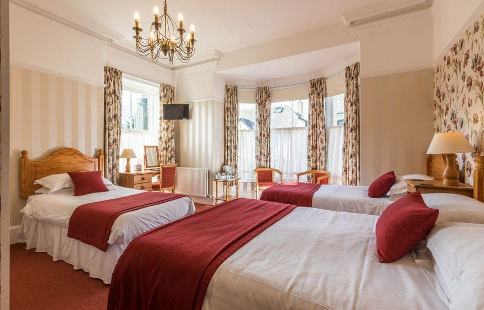 Family Room (2) | Premium bedding, desk, laptop workspace, blackout drapes