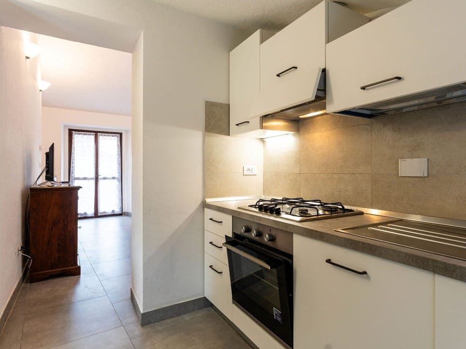 Kitchen, Flooring, Interior Design, Major Appliance, Countertop, Wood, Kitchen Appliance, Ceiling, Room, Floor