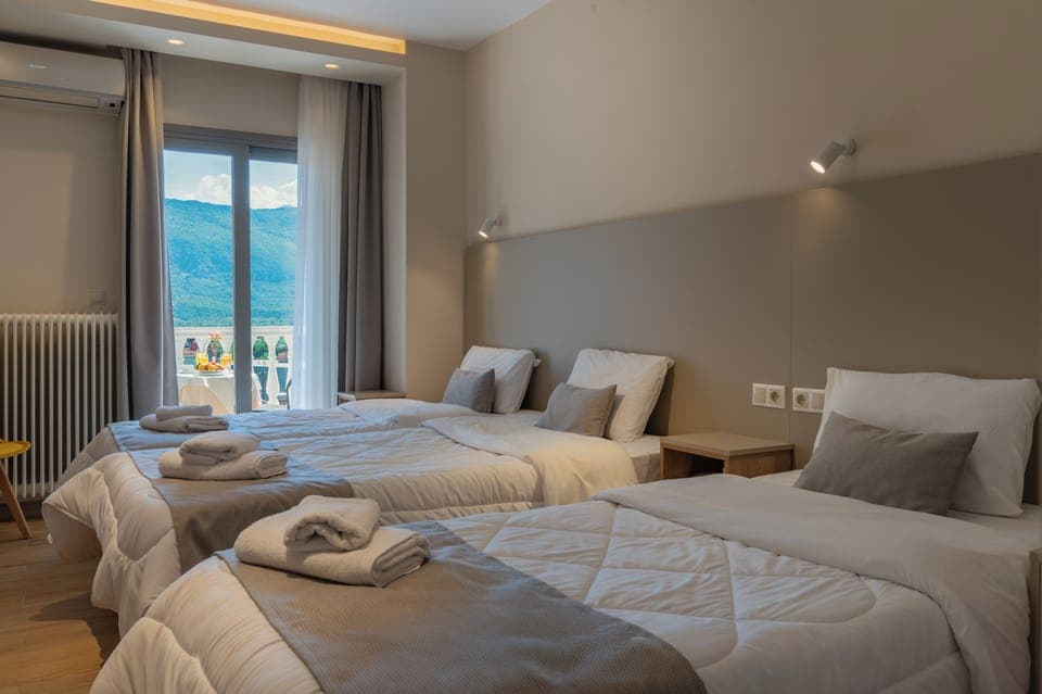 Family Triple Room, 3 Twin Beds, Non Smoking, Mountain View | In-room safe, soundproofing, iron/ironing board, free WiFi