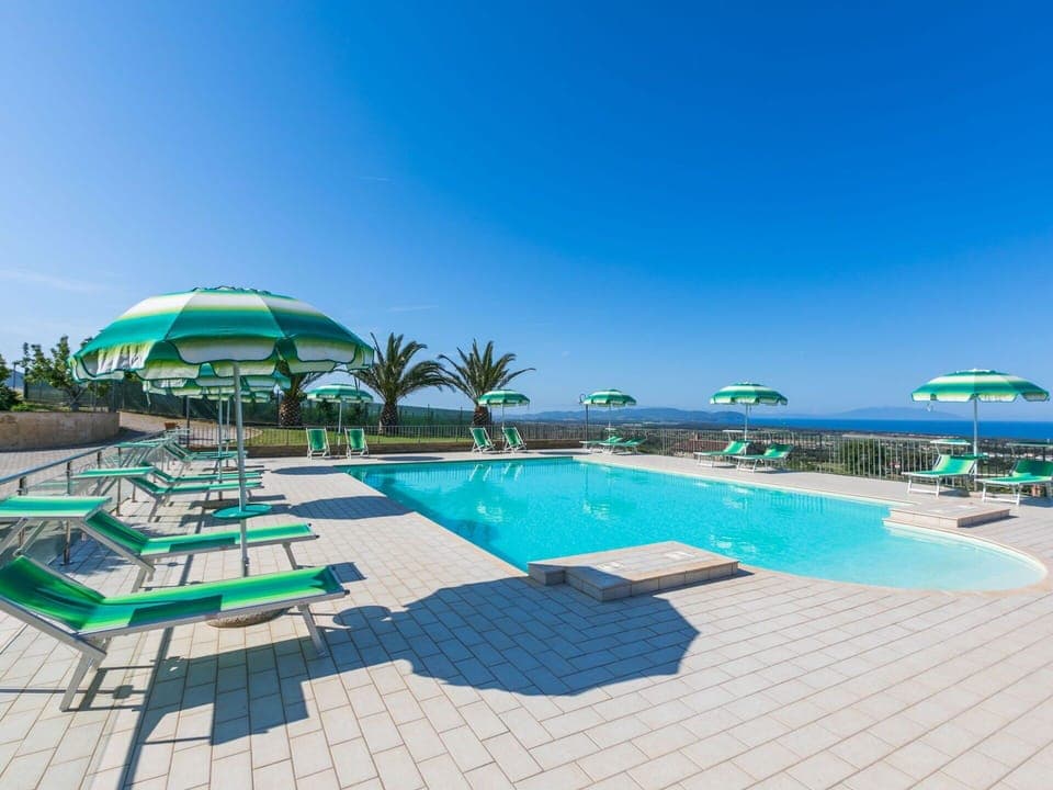 Sky, Water, Property, Swimming Pool, Seaside Resort, Azure, Outdoor Furniture, Shade, Sunlounger, Tree