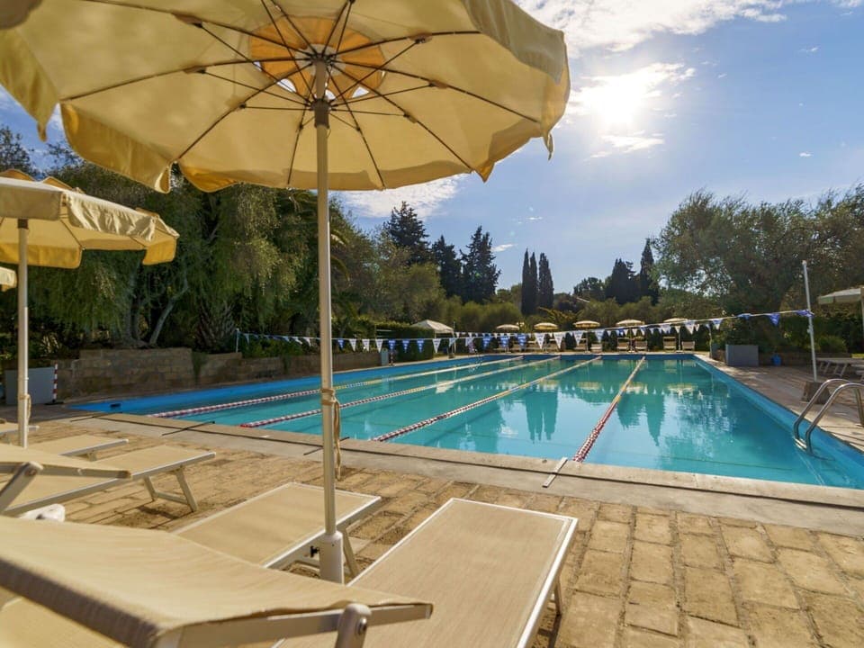 Water, Sky, Plant, Building, Umbrella, Cloud, Swimming Pool, Nature, Blue, Tree